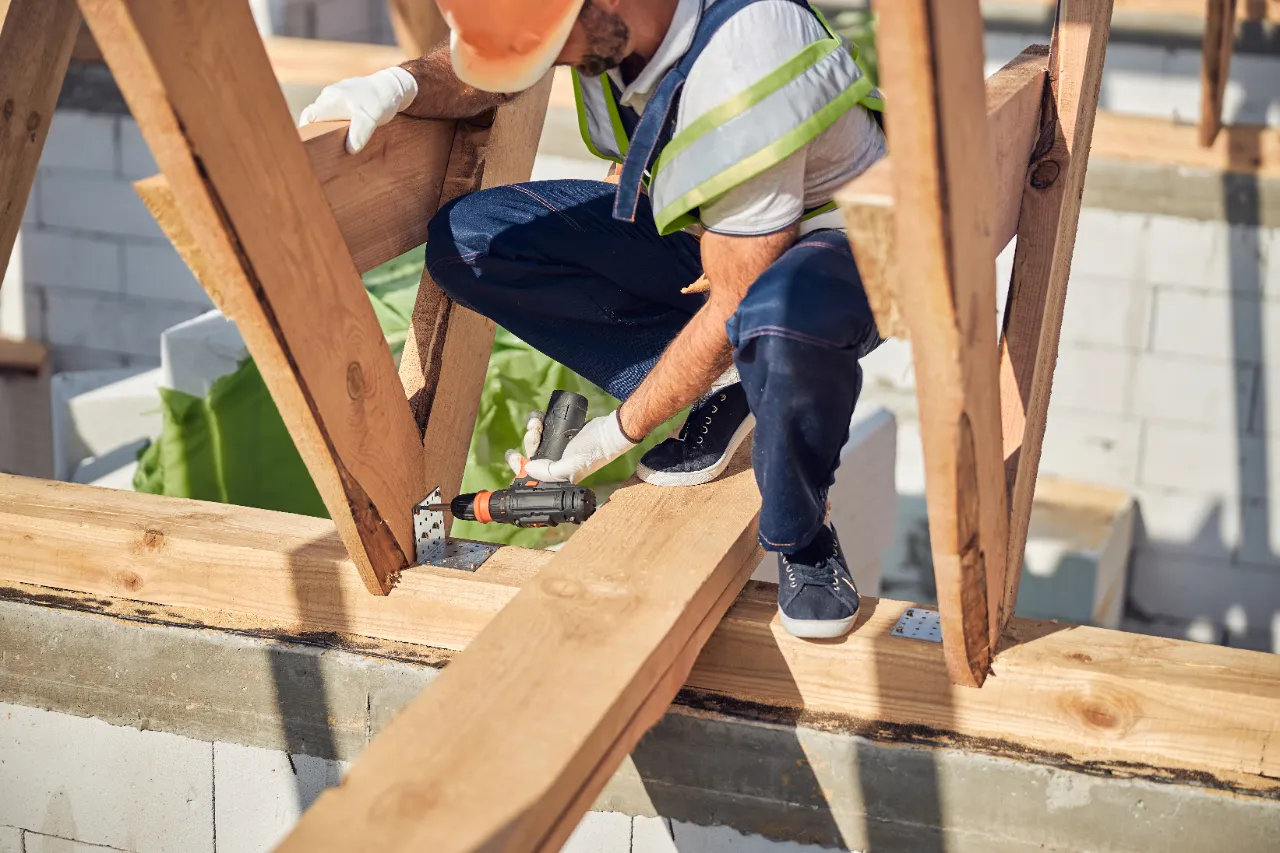 Carpenter framing a home addition in Connecticut
